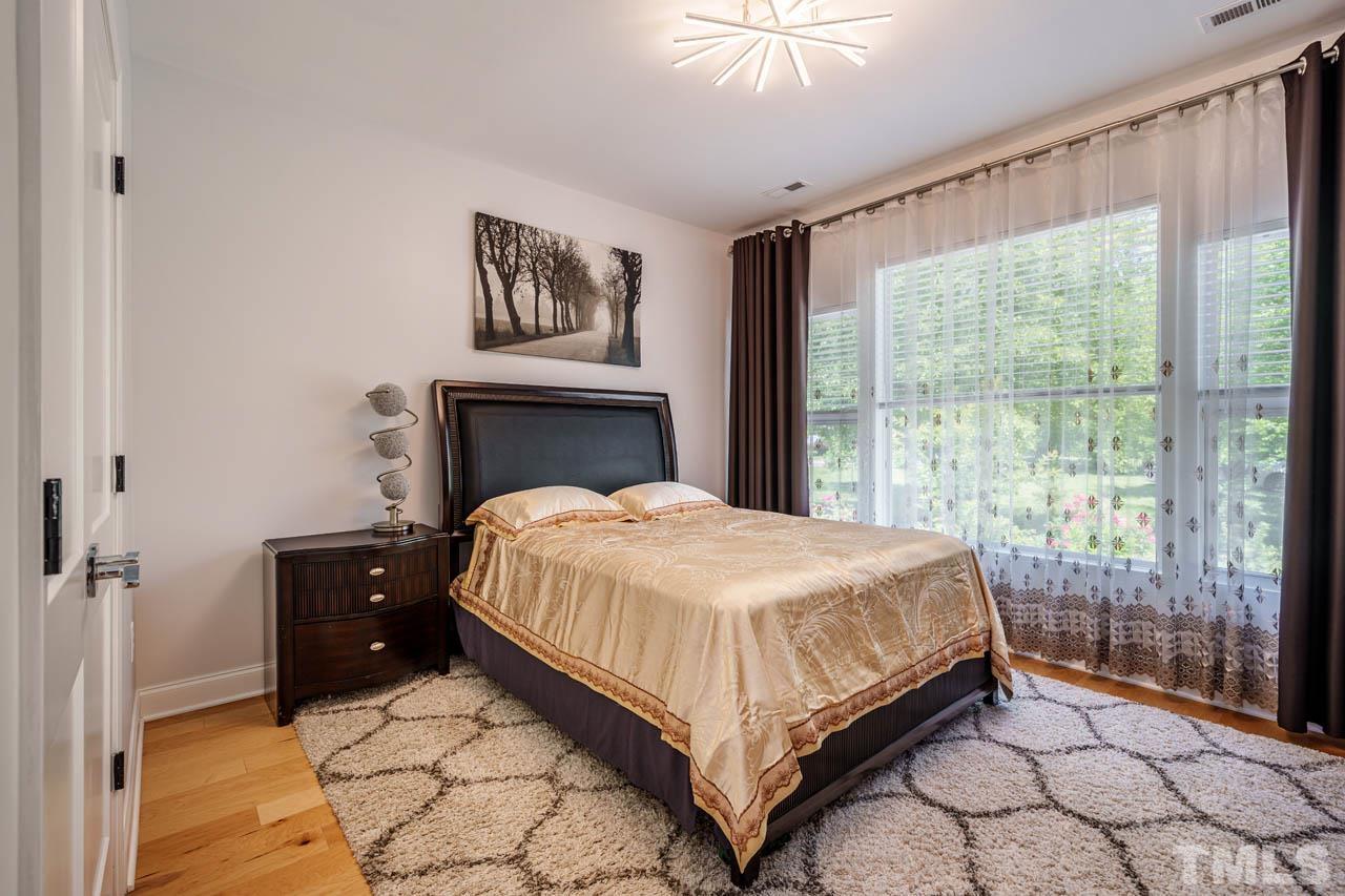 1028 Todd Road Knightdale, NC 27545 - Photo 19 of 48 a bedroom with a bed and a window