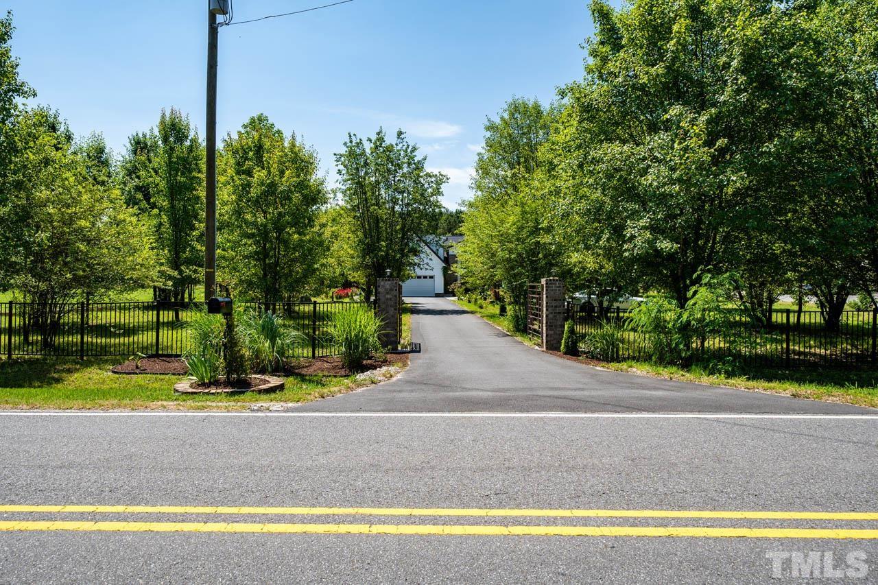 1028 Todd Road Knightdale, NC 27545 - Photo 2 of 48 a front view of a house with a yard