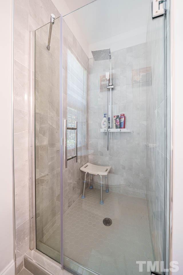 1028 Todd Road Knightdale, NC 27545 - Photo 21 of 48 a bathroom with a shower and a toilet