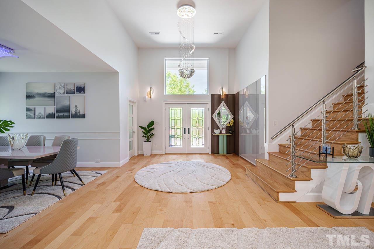 1028 Todd Road Knightdale, NC 27545 - Photo 24 of 48 a view of a dining room with furniture and wooden floor