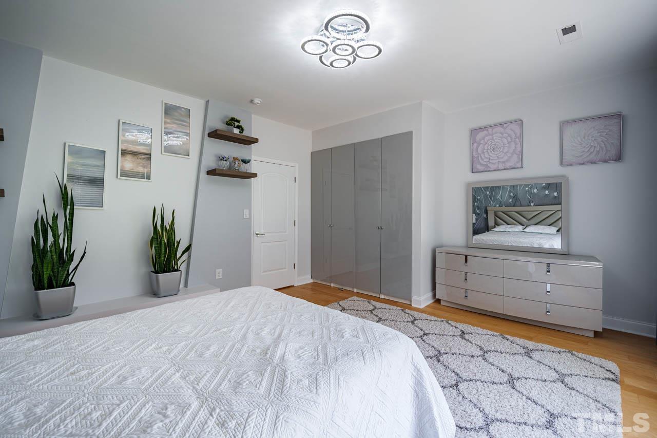 1028 Todd Road Knightdale, NC 27545 - Photo 27 of 48 a bedroom with a bed and a cabinets