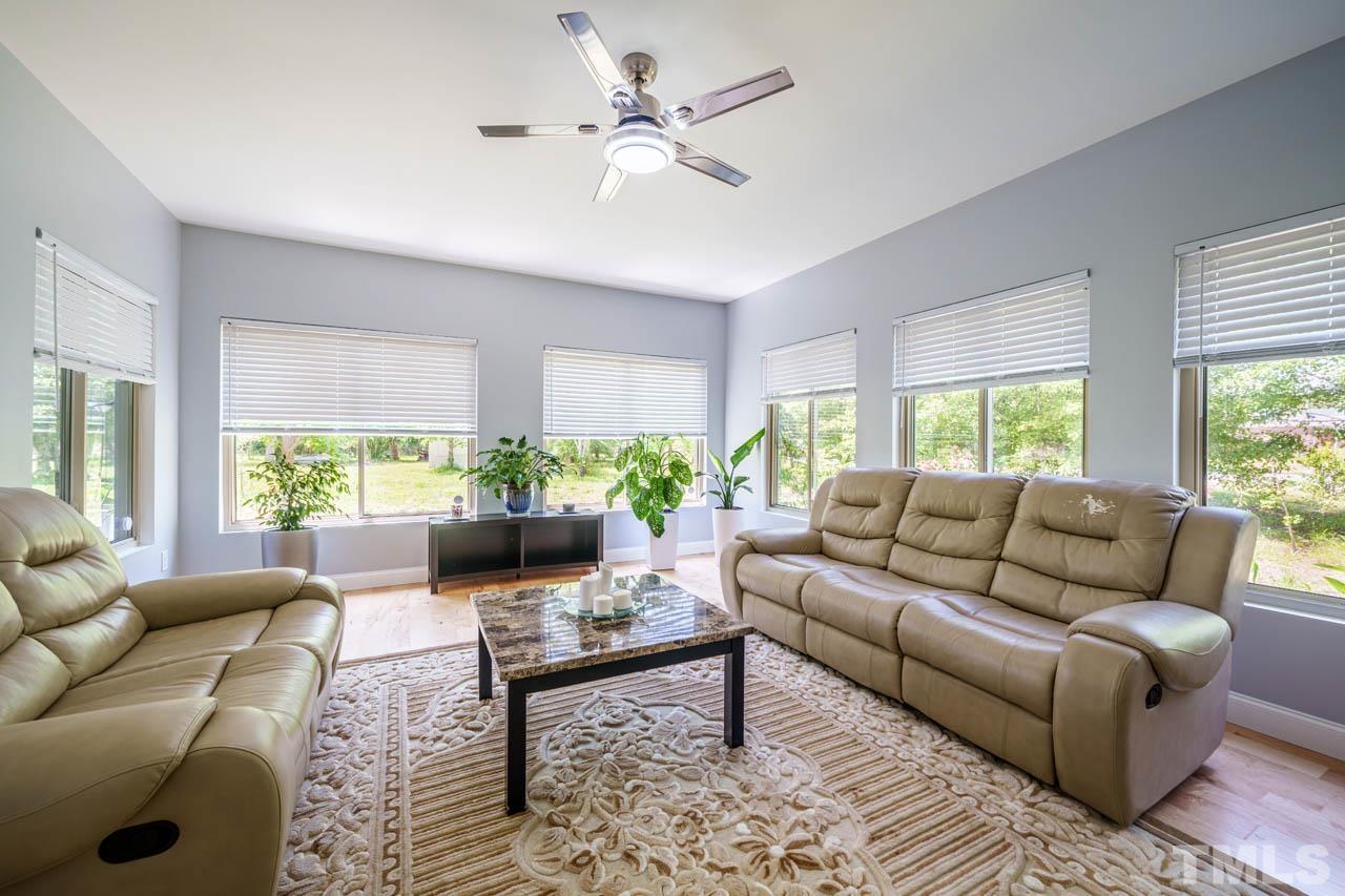 1028 Todd Road Knightdale, NC 27545 - Photo 32 of 48 a living room with furniture and a large window