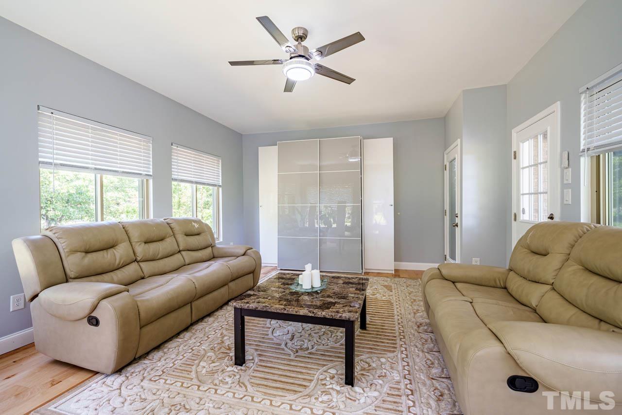 1028 Todd Road Knightdale, NC 27545 - Photo 33 of 48 a living room with furniture and a large window