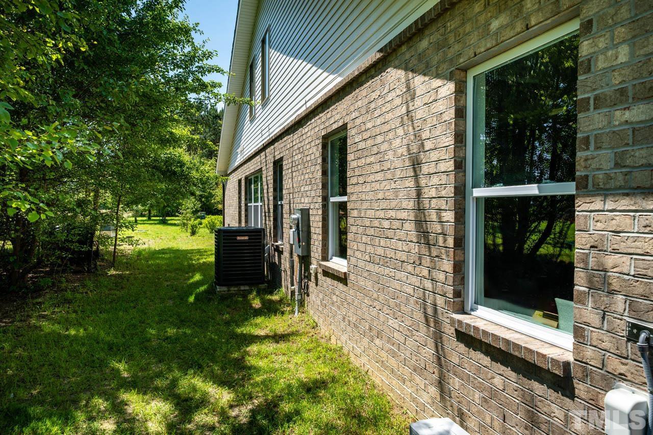1028 Todd Road Knightdale, NC 27545 - Photo 37 of 48 a view of a two chairs in the patio