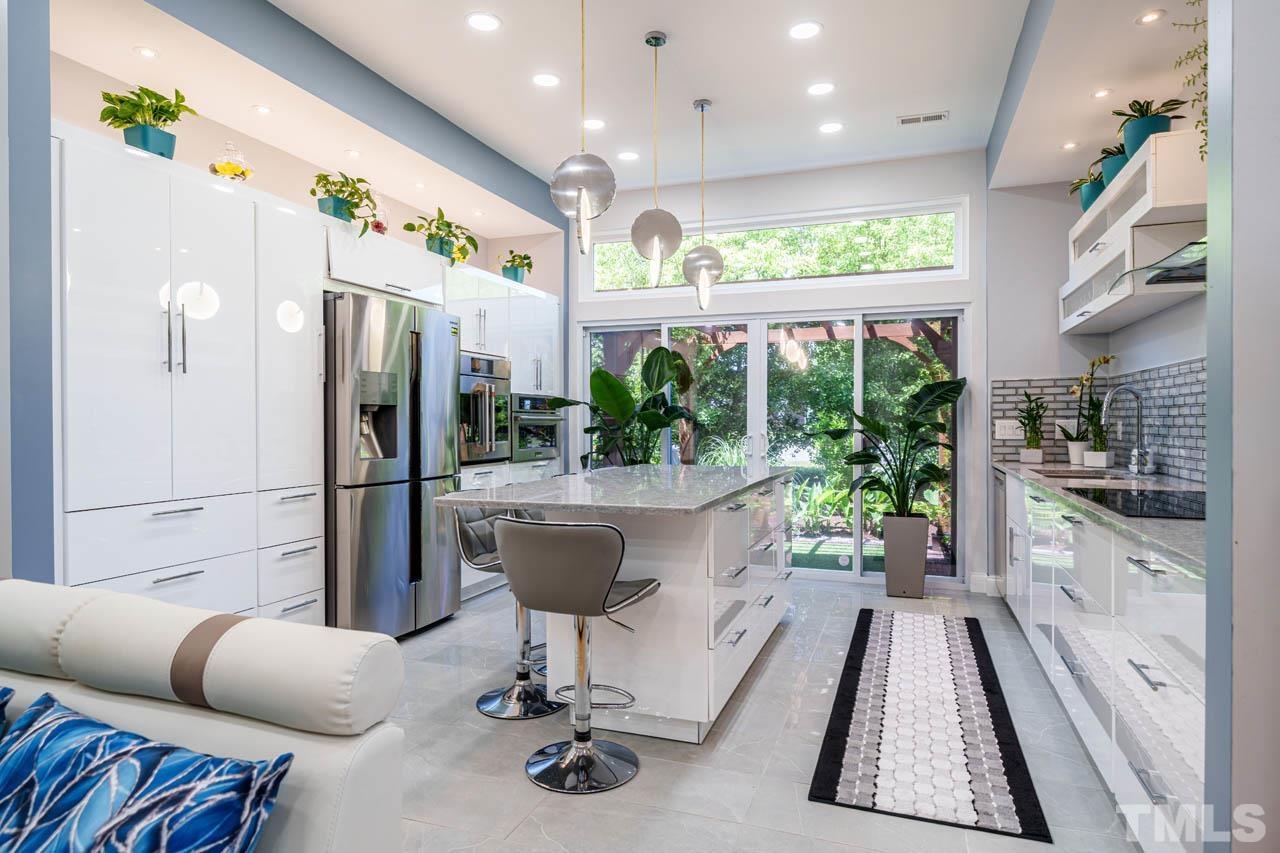 1028 Todd Road Knightdale, NC 27545 - Photo 42 of 48 a living room with furniture and a large window