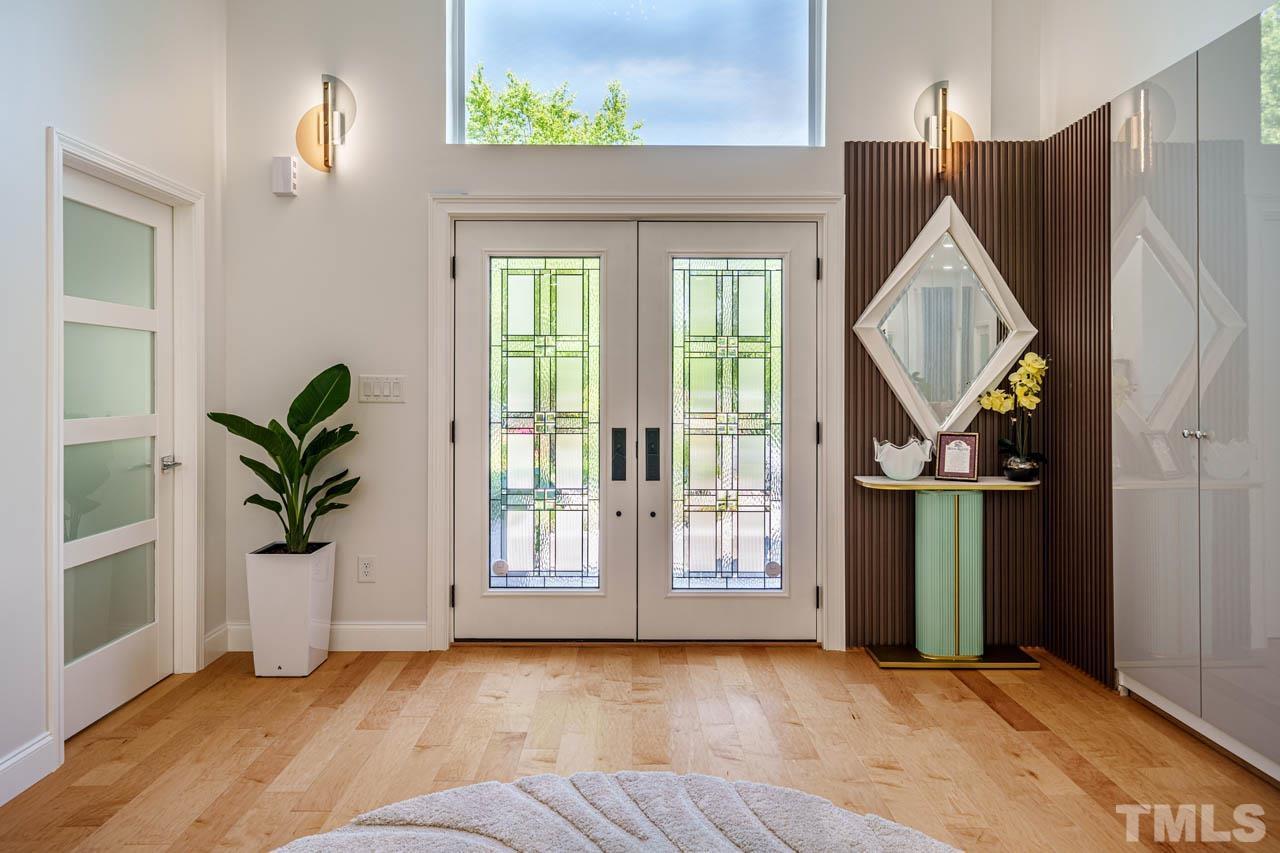 1028 Todd Road Knightdale, NC 27545 - Photo 45 of 48 a view of entryway and hall with wooden floor