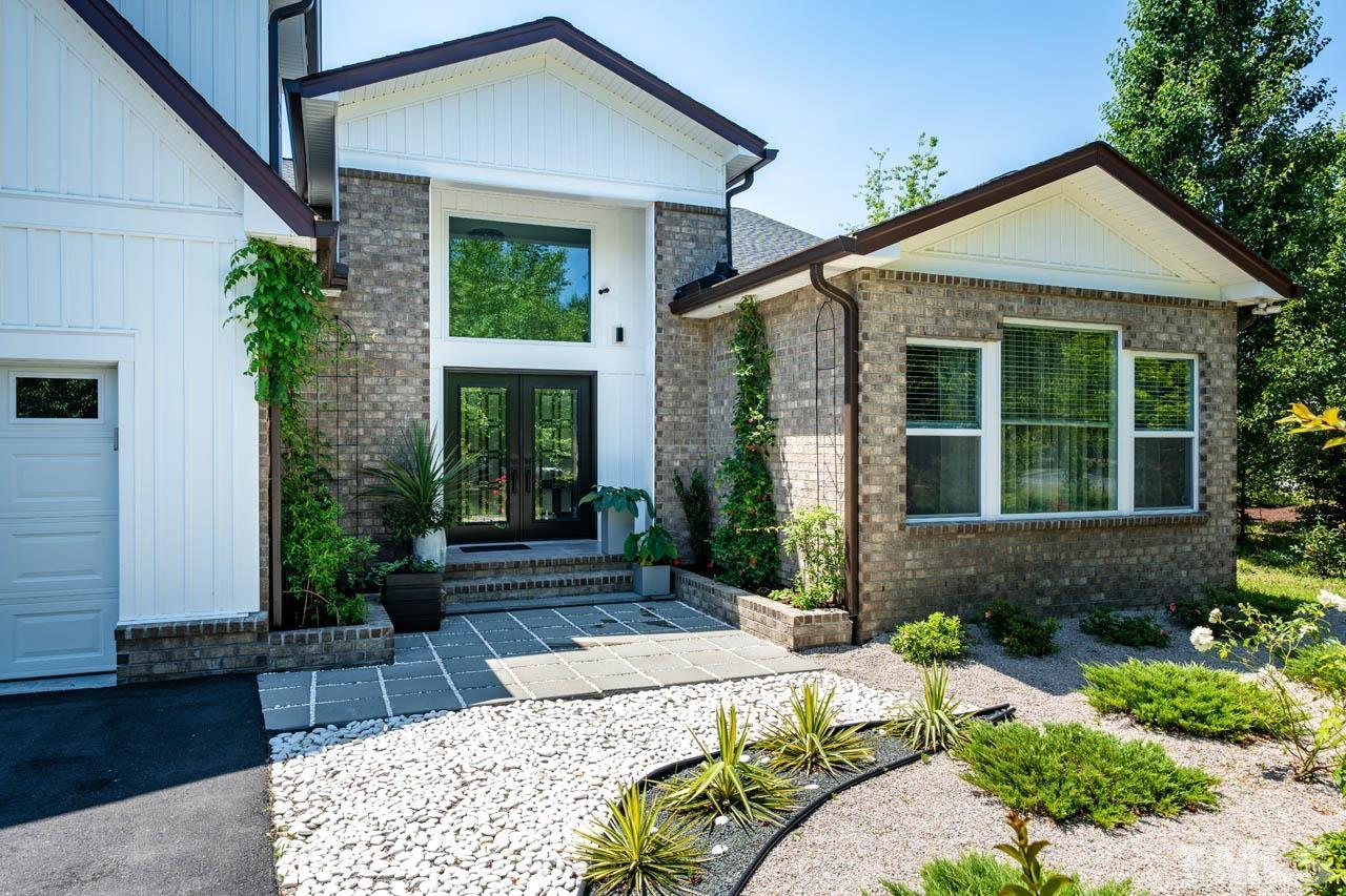 1028 Todd Road Knightdale, NC 27545 - Photo 6 of 48 a front view of a house with garden