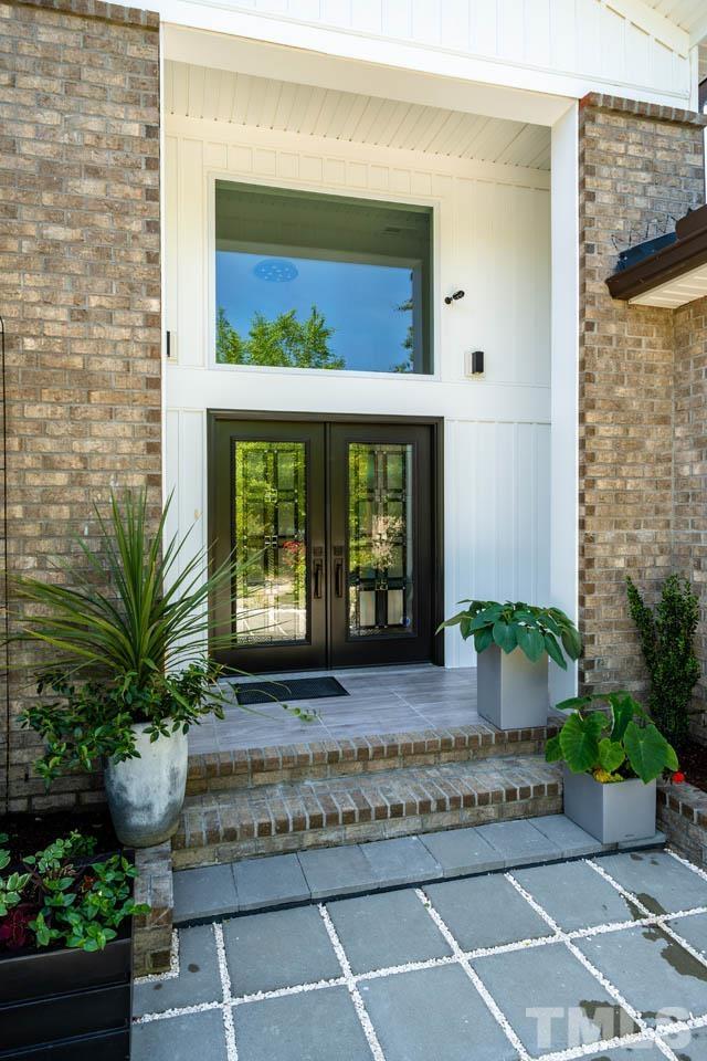 1028 Todd Road Knightdale, NC 27545 - Photo 7 of 48 a front view of a house with potted plants