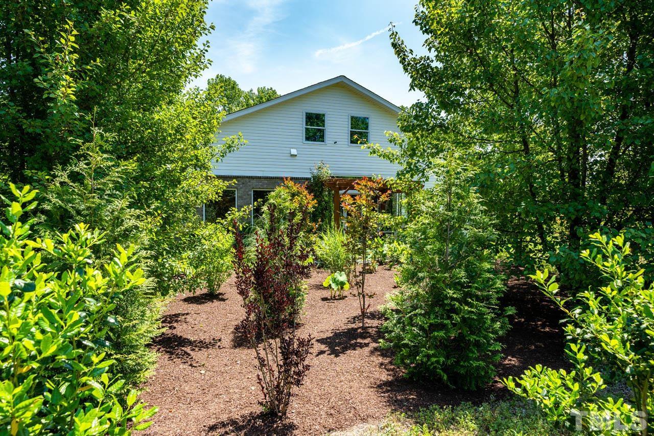 1028 Todd Road Knightdale, NC 27545 - Photo 9 of 48 a house is sitting in middle of forest