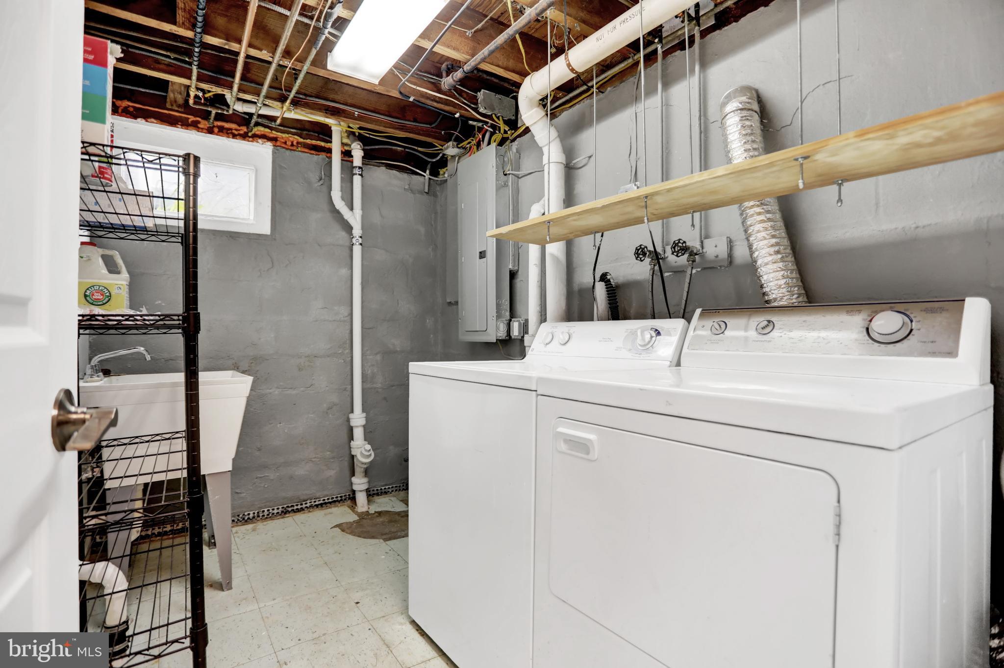 5544 Ashbourne Road Baltimore, MD 21227 - Photo 34 of 40 a utility room with dryer and washer