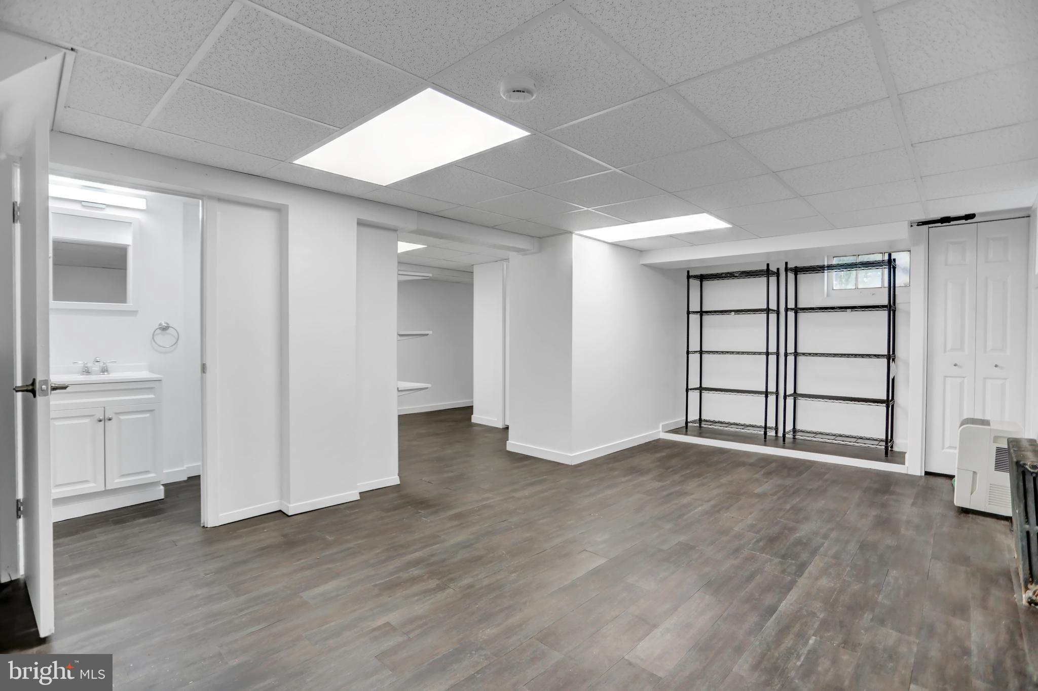 5544 Ashbourne Road Baltimore, MD 21227 - Photo 4 of 40 an empty room with closet and windows