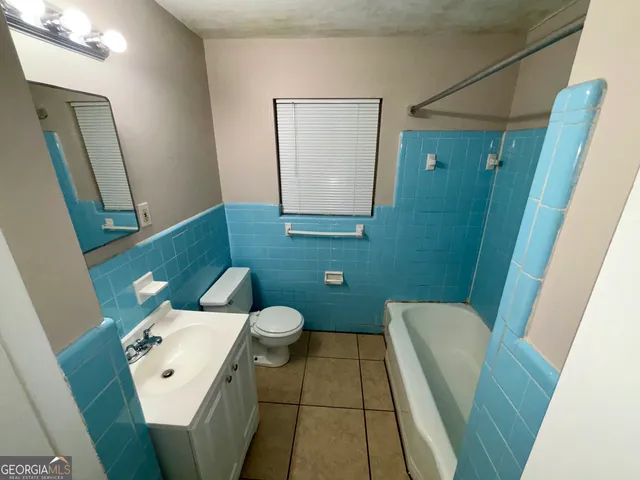 a bathroom with a toilet and a sink