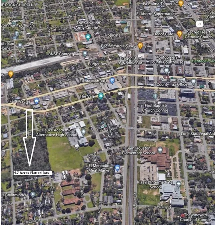 a view of a street with trees on both side of it