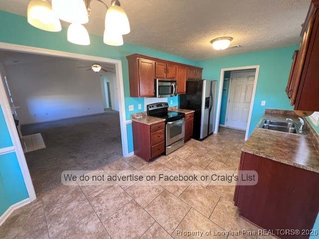 2249 Chasewater Road Fayetteville, NC 28306 - Photo 3 of 13 a kitchen with stainless steel appliances granite countertop a sink stove and refrigerator