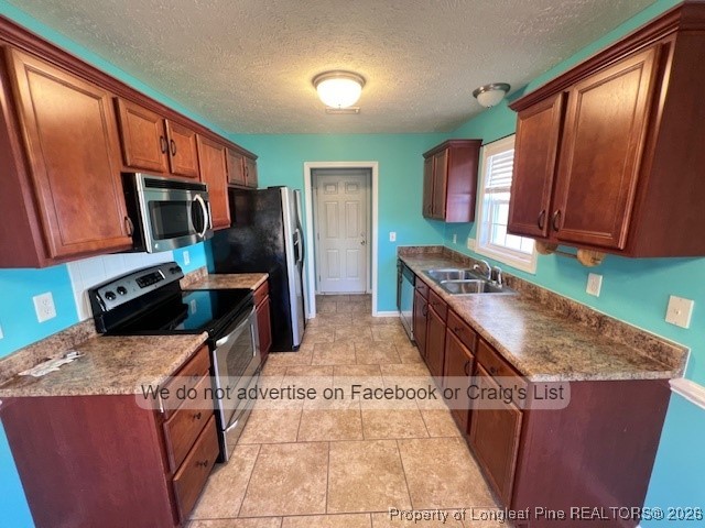 2249 Chasewater Road Fayetteville, NC 28306 - Photo 4 of 13 a kitchen with stainless steel appliances granite countertop a stove a sink dishwasher and a refrigerator