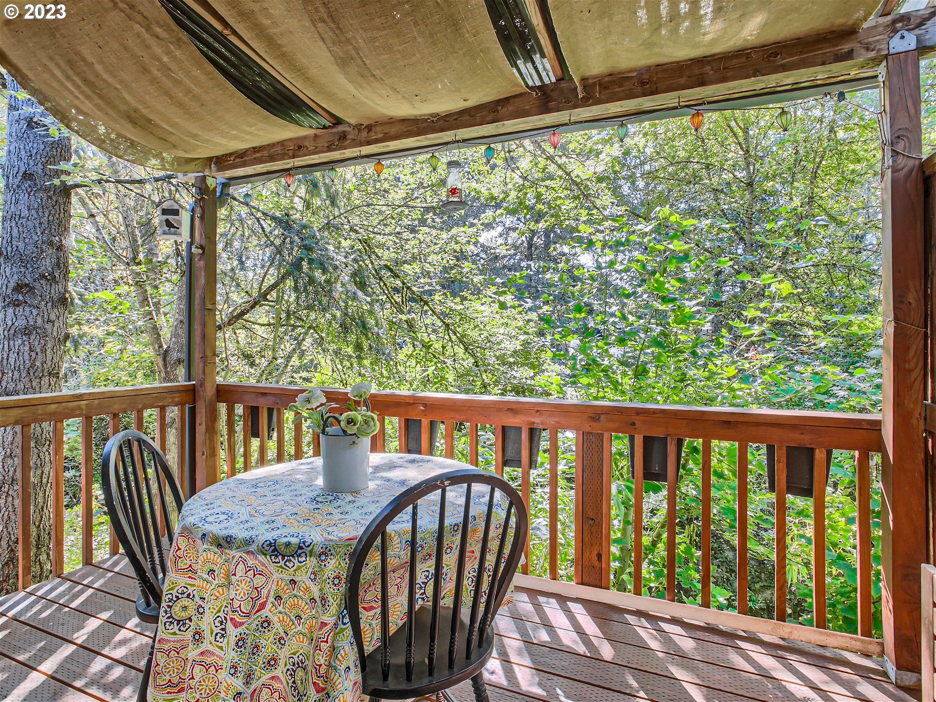 11224 Southwest Bel Aire Lane, Unit 10 Beaverton, OR 97008 - Photo 23 of 25 a view of a balcony with furniture and wooden deck