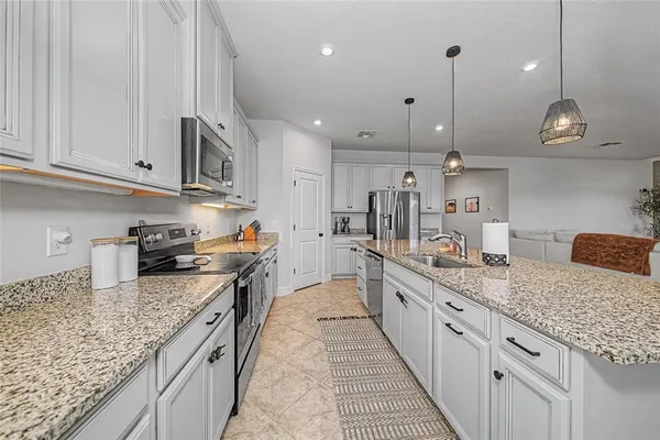 a large kitchen with lots of counter space and appliances