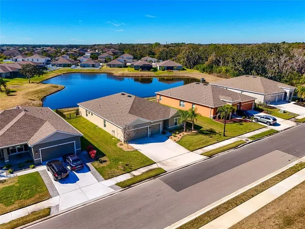 an aerial view of a house with a ocean view