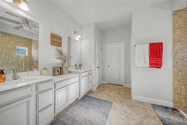 a bedroom with a bed and a lamp