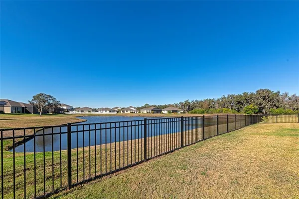 an aerial view of a residential houses with outdoor space