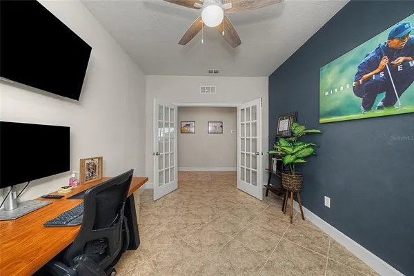 a workspace with furniture and a potted plant