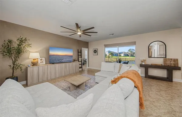 a living room with furniture and a table