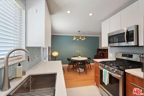 a kitchen with a stove and a microwave