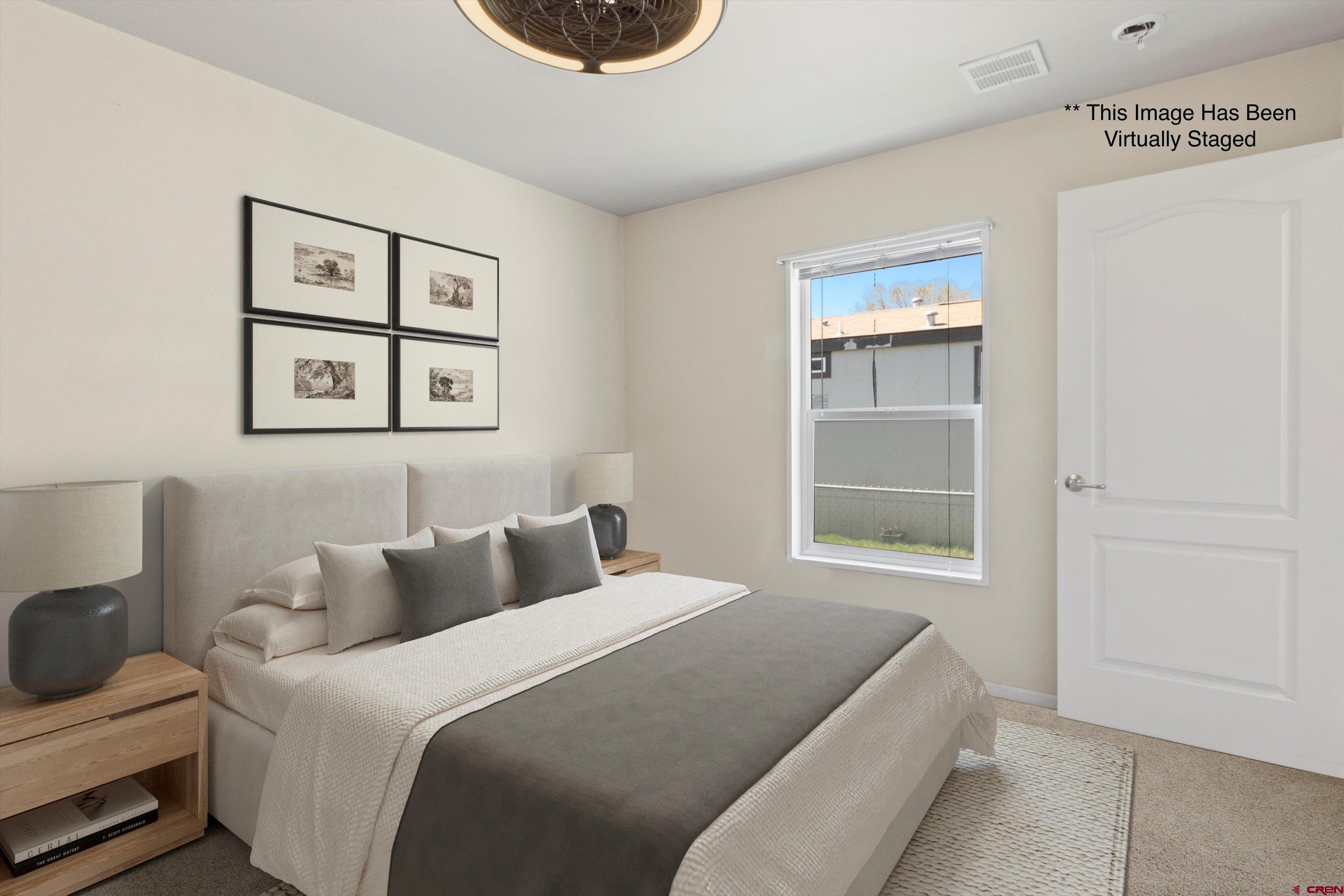 6000 County Road 203, Unit 34 Durango, CO 81301 - Photo 4 of 33 a bedroom with a bed and a window