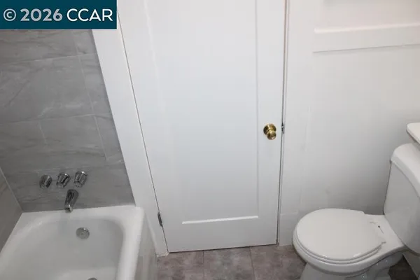 a bath room with a toilet and a sink