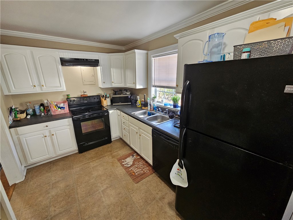 237 Pine Lane Anderson, SC 29621 - Photo 11 of 22 This kitchen offers functional design with essential appliances and ample cabinet space.