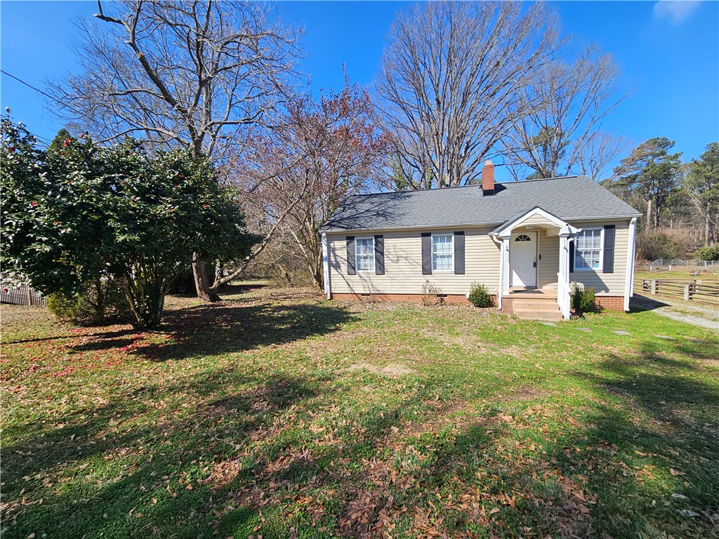237 Pine Lane Anderson, SC 29621 - Photo 3 of 22 Charming home with classic architecture, inviting porch, and ample green space for outdoor enjoyment.