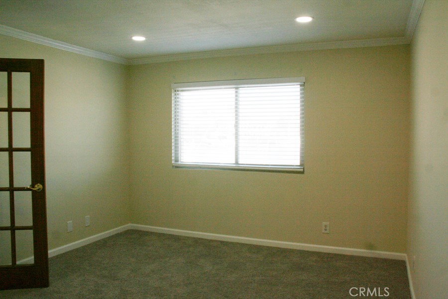 17140 Bluewater Lane, Unit 154 Huntington Beach, CA 92649 - Photo 12 of 28 an empty room with a window
