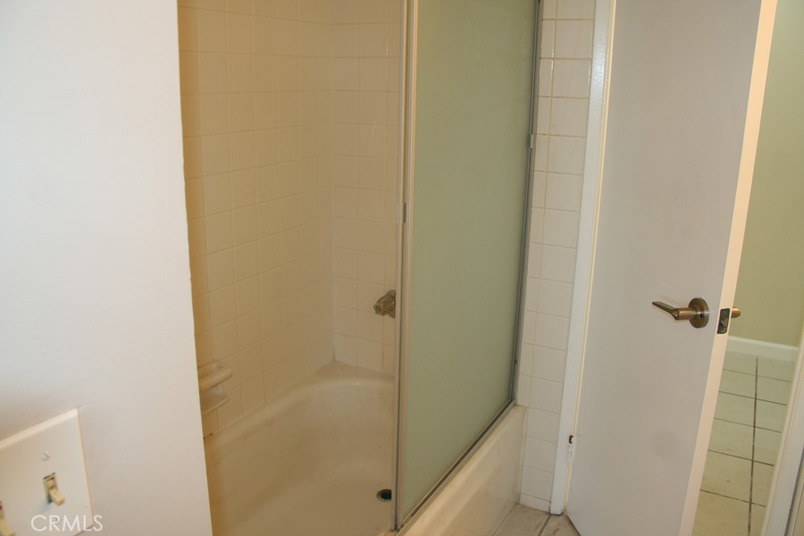 17140 Bluewater Lane, Unit 154 Huntington Beach, CA 92649 - Photo 15 of 28 a bathroom with a shower