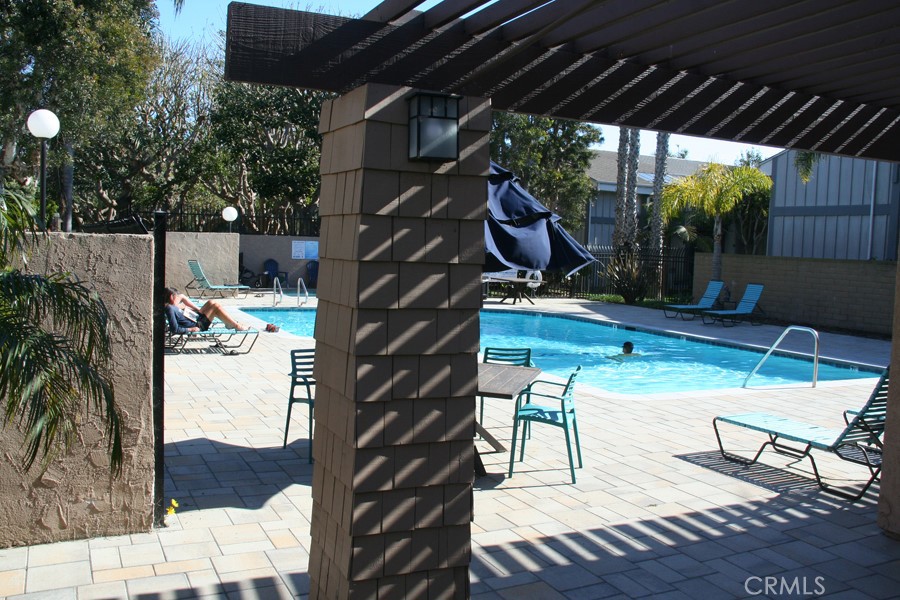 17140 Bluewater Lane, Unit 154 Huntington Beach, CA 92649 - Photo 25 of 28 a view of outdoor space yard deck patio and outdoor seating