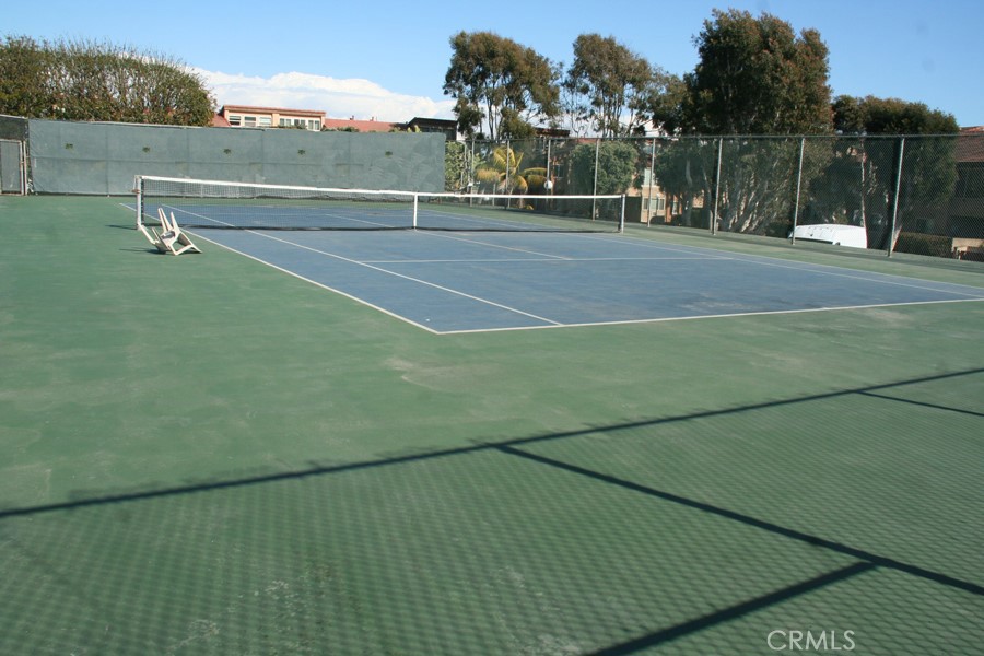 17140 Bluewater Lane, Unit 154 Huntington Beach, CA 92649 - Photo 26 of 28 a view of a tennis court