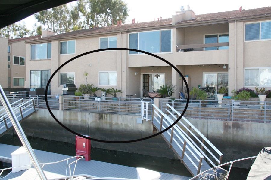 17140 Bluewater Lane, Unit 154 Huntington Beach, CA 92649 - Photo 3 of 28 a view of a swimming pool with outdoor seating