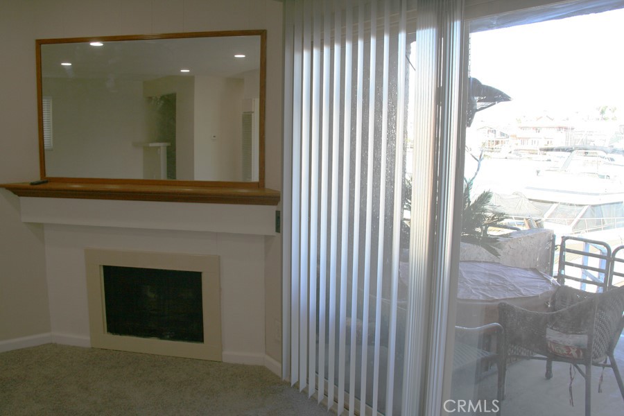 17140 Bluewater Lane, Unit 154 Huntington Beach, CA 92649 - Photo 7 of 28 a view of a livingroom with a fireplace