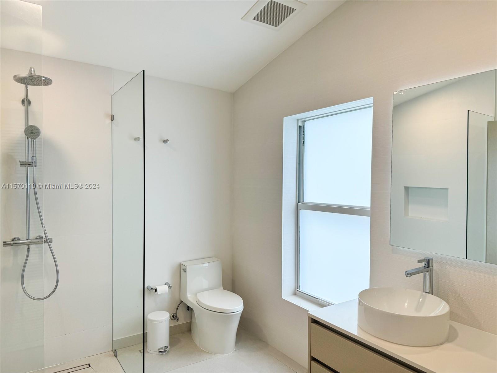 1945 Lakeshore Drive Weston, FL 33326 - Photo 13 of 19 a bathroom with a sink toilet and shower