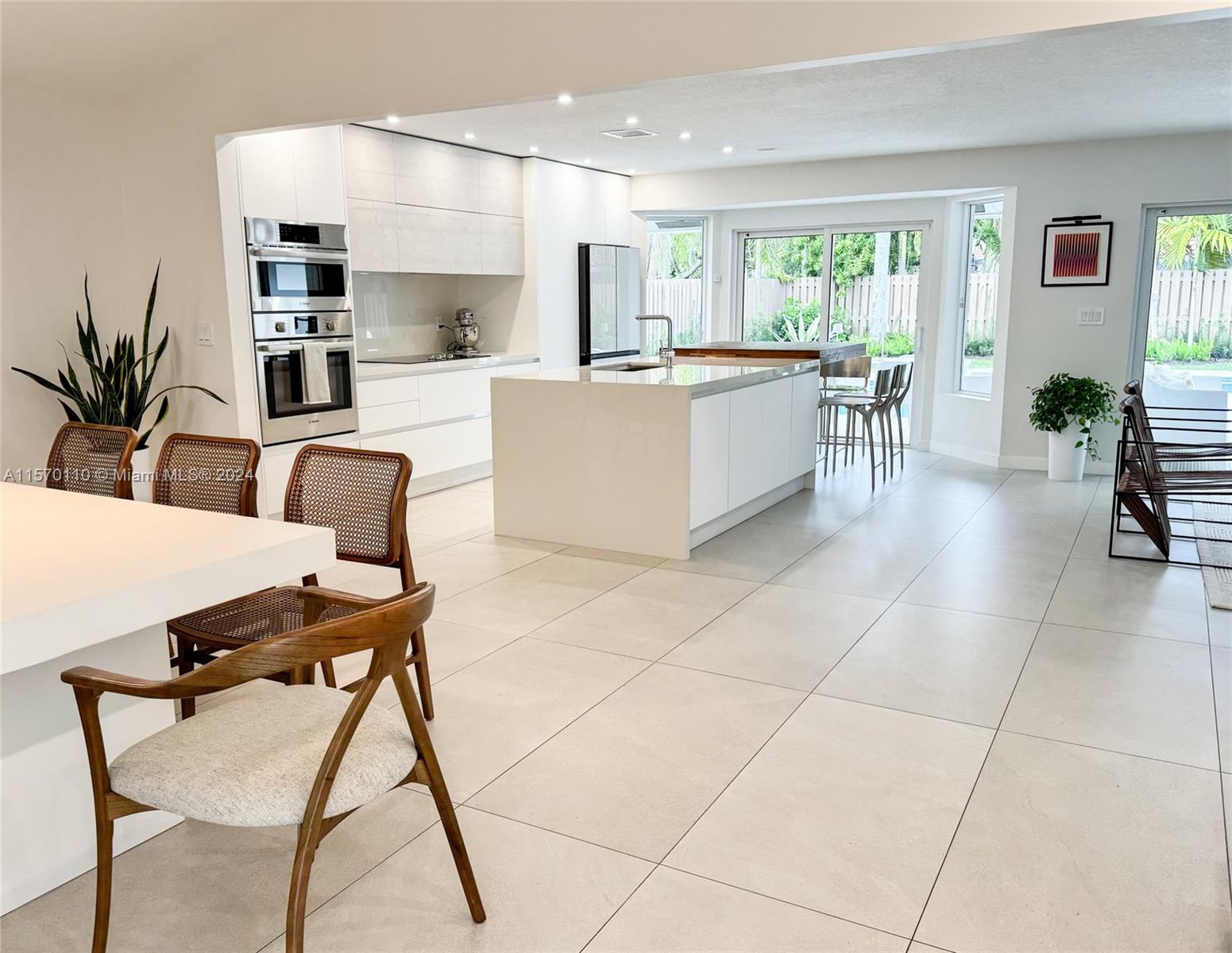 1945 Lakeshore Drive Weston, FL 33326 - Photo 4 of 19 a view of kitchen with furniture and large window