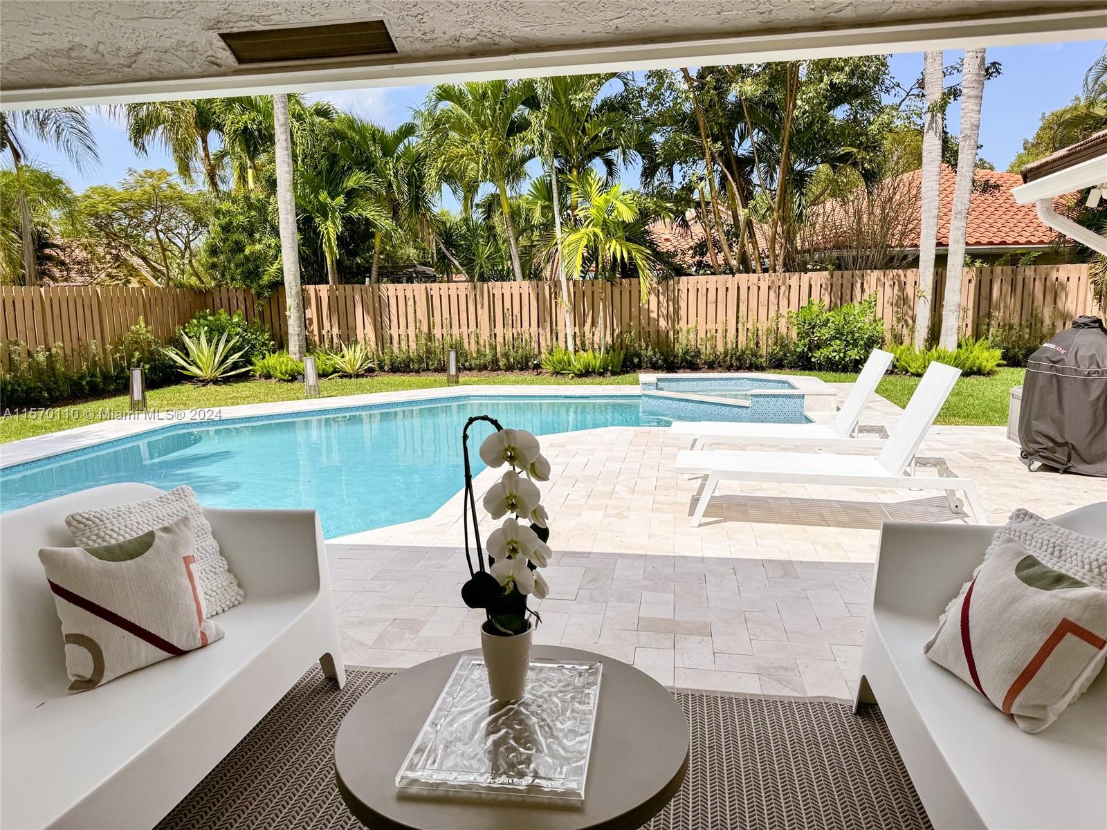 1945 Lakeshore Drive Weston, FL 33326 - Photo 8 of 19 a living room with a couch and a floor to ceiling window
