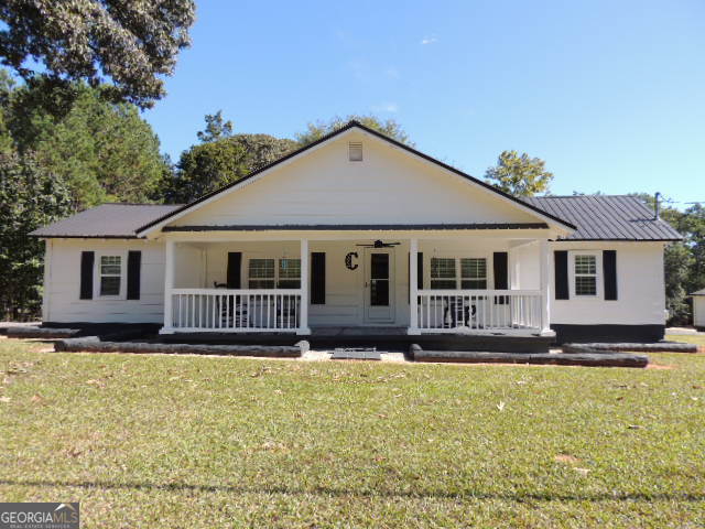 a house view with a garden space
