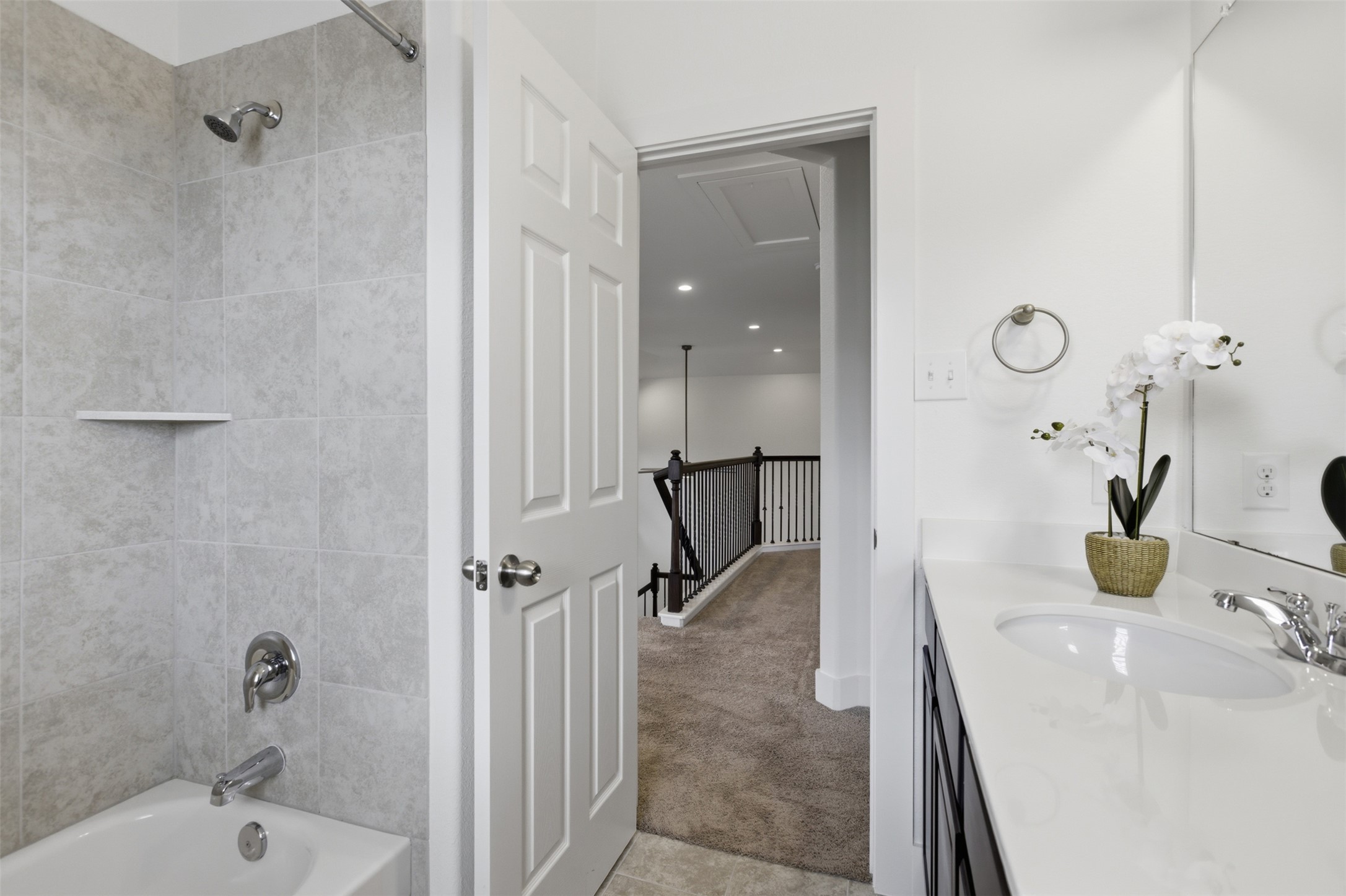 2004 Garretts Way Manchaca, TX 78652 - Photo 19 of 24 Full bathroom featuring light carpet, vanity, and washtub / shower combination