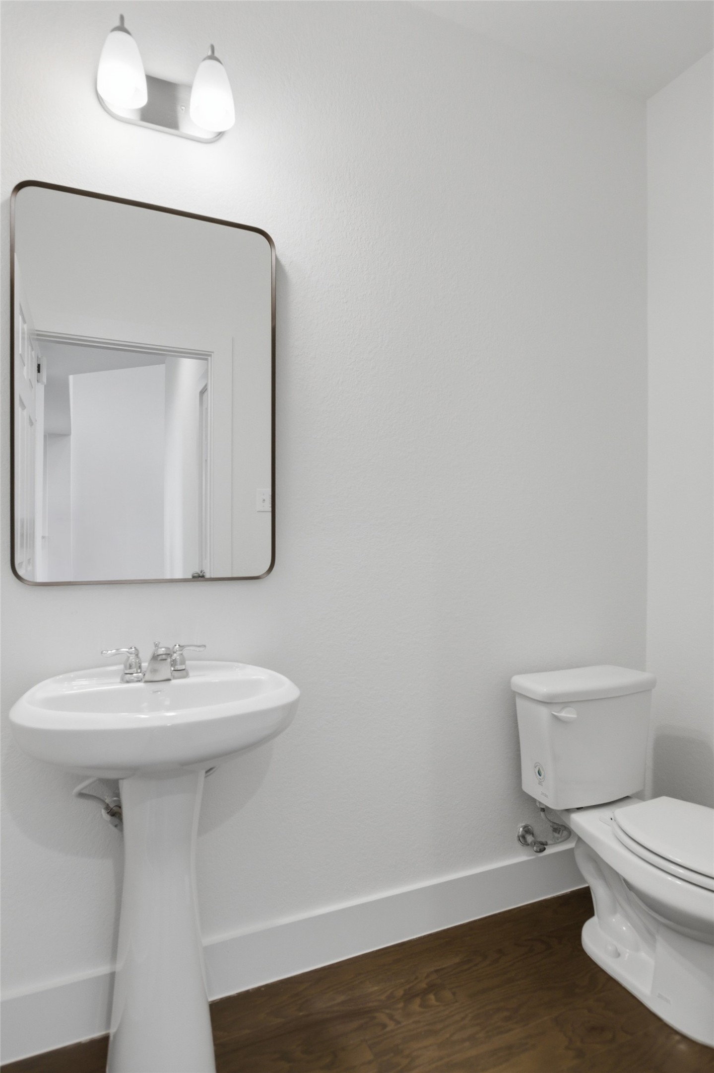 2004 Garretts Way Manchaca, TX 78652 - Photo 20 of 24 Half bathroom with toilet and dark wood-type flooring