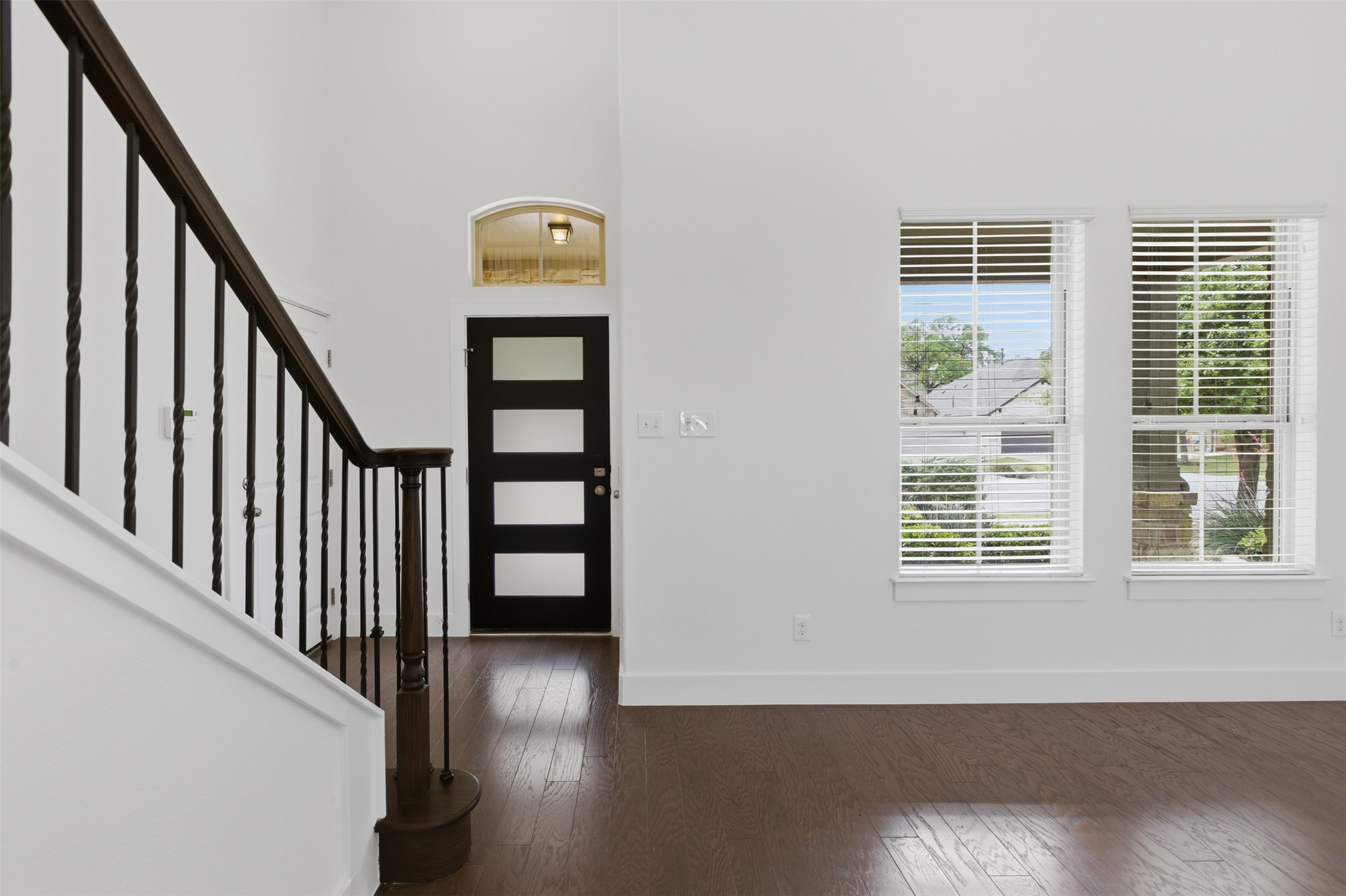 2004 Garretts Way Manchaca, TX 78652 - Photo 7 of 37 Entrance foyer featuring dark wood-type flooring and a high ceiling