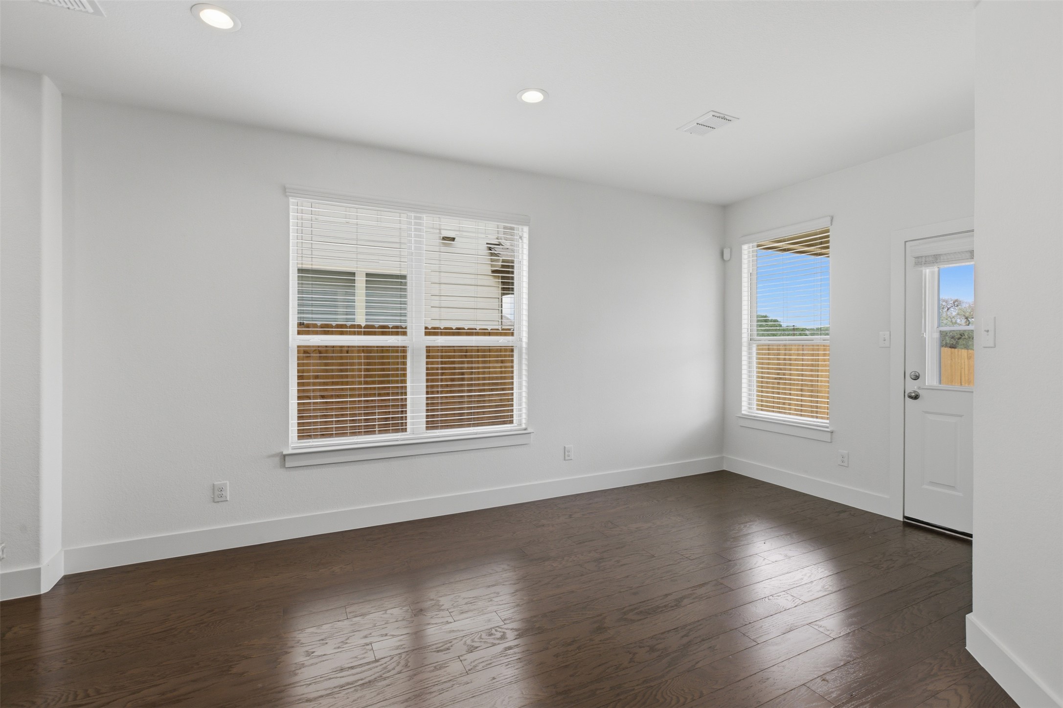 2004 Garretts Way Manchaca, TX 78652 - Photo 8 of 24 Unfurnished room with dark wood finished floors and recessed lighting
