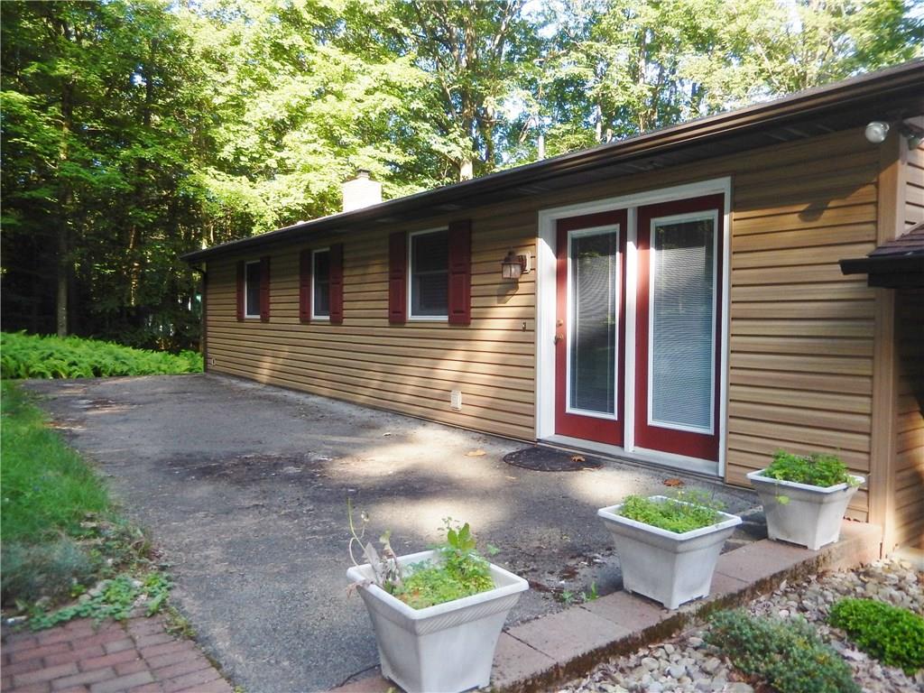 2107 Rocky Ridge Road Acme, PA 15610 - Photo 22 of 25 Relax on the back patio after a long day. Enjoy a night of grilling dinner or enjoying a cool glass of iced tea in your private paradise