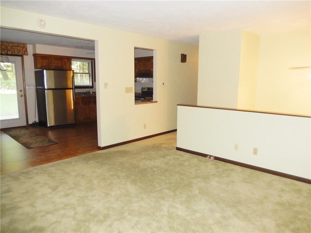 2107 Rocky Ridge Road Acme, PA 15610 - Photo 5 of 25 Living room opens to the dining and kitchen areas