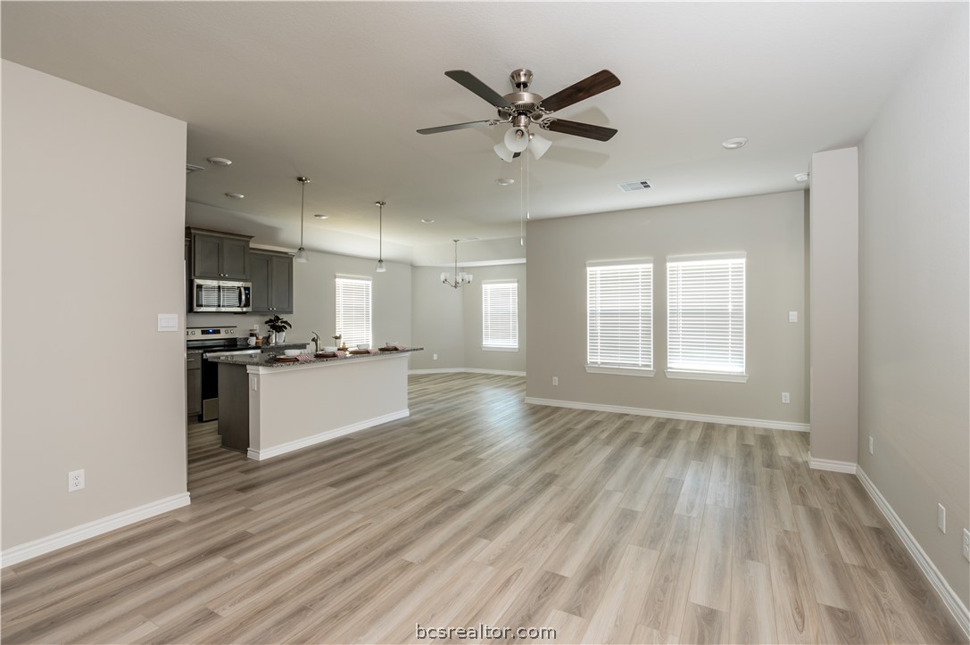 2159 Chief Street Bryan, TX 77807 - Photo 3 of 22 a view of a kitchen with wooden floor and a window