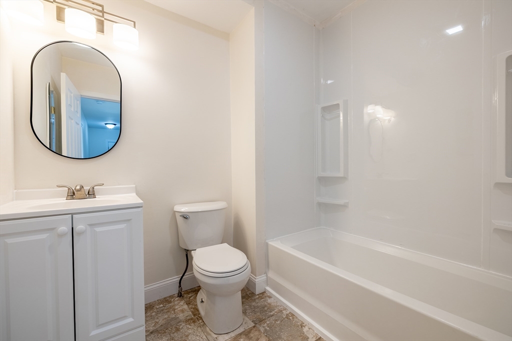 15 Rose Street, Unit 2 Haverhill, MA 01830 - Photo 11 of 15 a bathroom with a toilet a sink and bathtub
