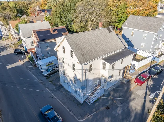 an aerial view of a house with outdoor space